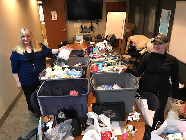 Wear2Start Society vice-president Diane Carpenter, left, and W2S volunteer Dawn Hart help to sort the thousands of personal care items donated to our organization during our Beyond the Start Blue Bag Challenge.